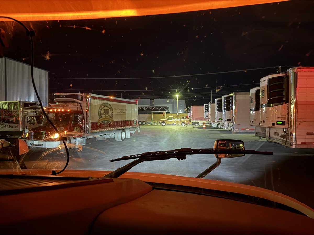 WIN Distribution truck on the road at night