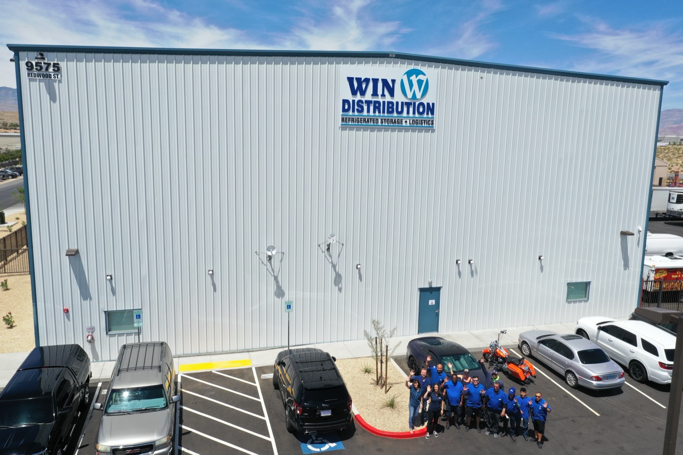 WIN Distribution team in front of headquarters